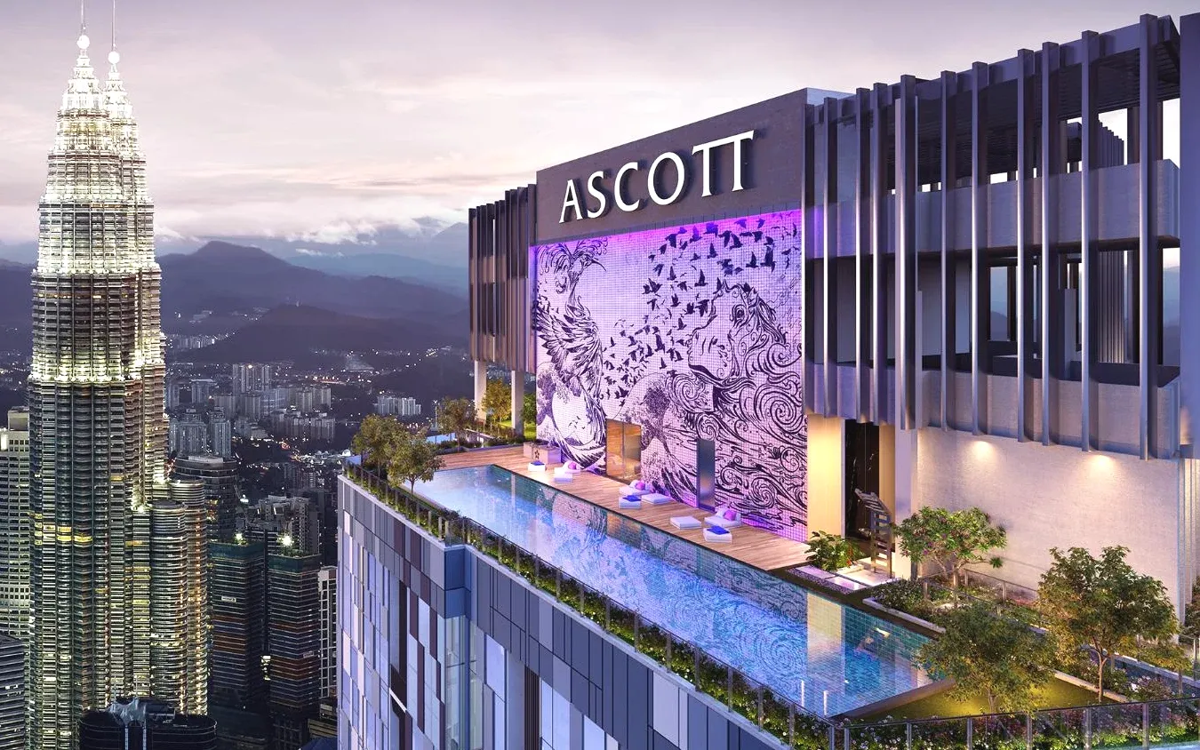 A rooftop swimming pool with a view of the twin towers Ascott Star KLCC Kuala Lumpur Premium 5-Star Hotel