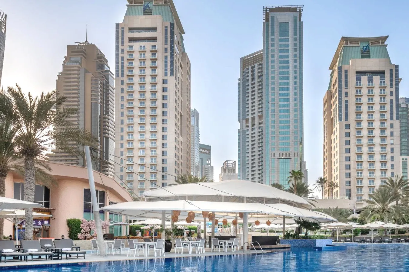Swimming pool and many buildings Prestigious Hotel Al Habtoor Grand Resort Autograph Collection in Dubai